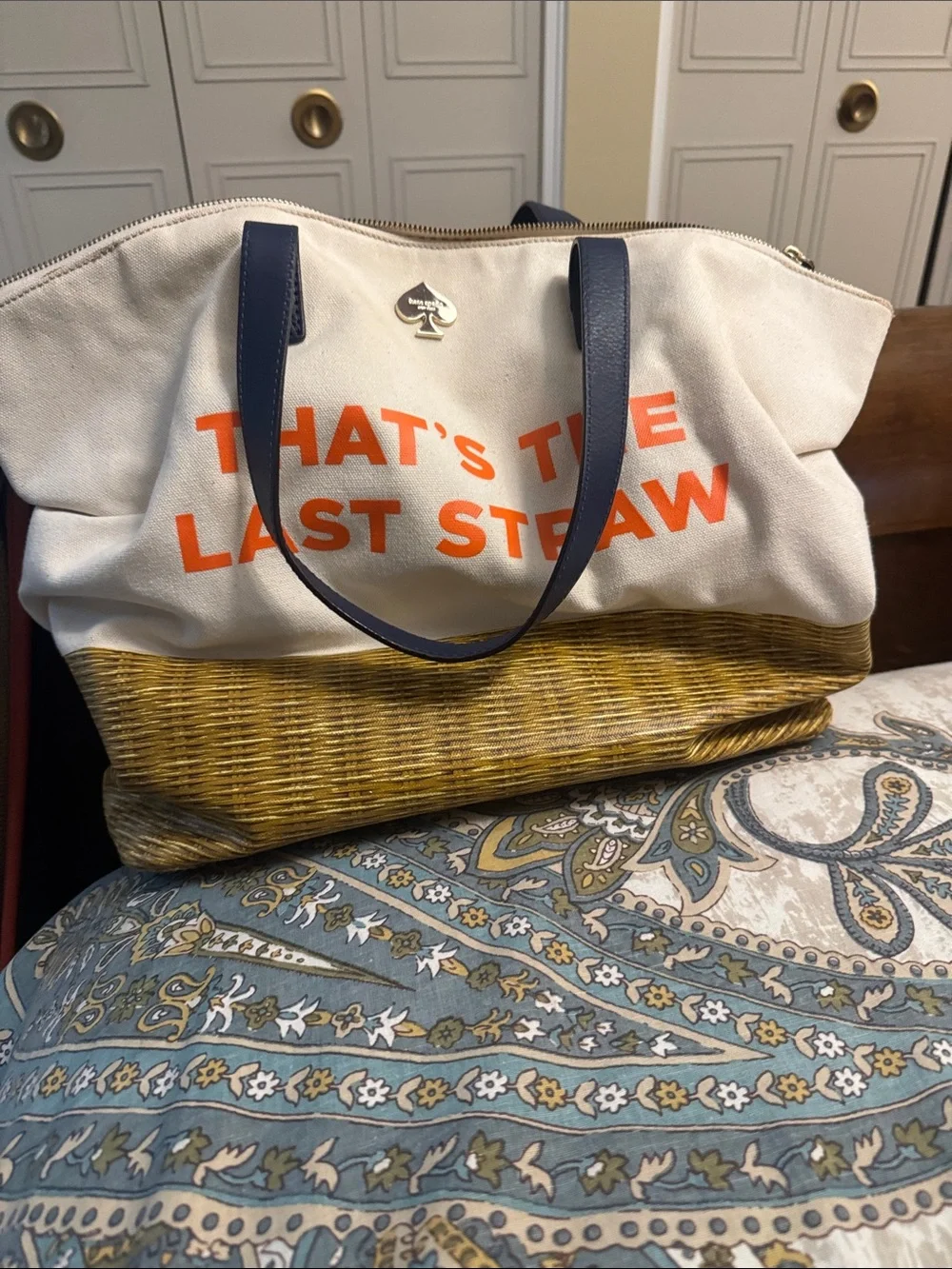 kate spade canvas tote with orange That’s the last straw text and blue handles.